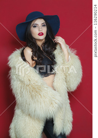 Sexy fashion model woman with long dark wavy hairstyle and red lips make-up  116290214