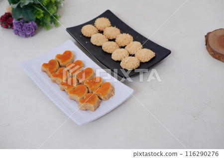 Kue Lebaran is an Assorted Indonesian specialty cookies for Eid al-Fitr or Eid Mubarak. such as Nastar, snow white, kaastengels and thumbprint cookies. Kue Lebaran is an Assorted Indonesian specialty cookies for Eid al-Fitr or Eid Mubarak. such as Nastar, snow white, kaastengels and thumbprint cookies. 116290276