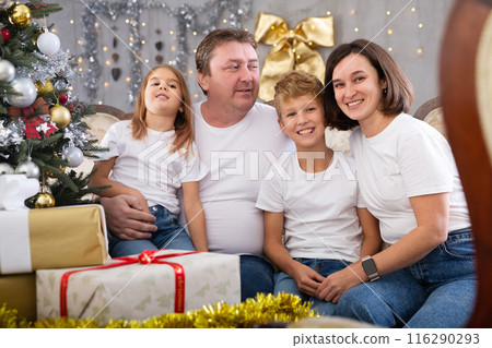 Portrait of family who is satisfied of gifts in time celebration New Year at home Portrait of family who is satisfied of gifts in time celebration New Year at home 116290293