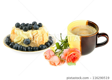 Meringue cake with blueberries and a cup of hot chocolate isolated on white. 116290519