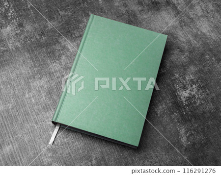 green hard cover book mock up on a wooden table 116291276