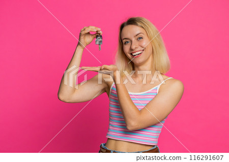 Caucasian woman real estate agent showing keys of new home house apartment, buying renting property Caucasian woman real estate agent showing keys of new home house apartment, buying renting property 116291607