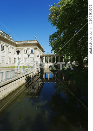 Canal next to palace on isle in Warsaw city in Poland - vertical Canal next to palace on isle in Warsaw city in Poland - vertical 116291901
