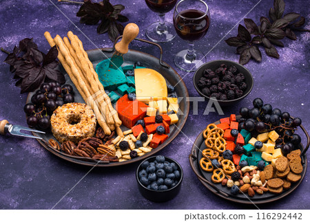 Halloween appetizers. Cheese plate with snacks Halloween appetizers. Cheese plate with snacks 116292442