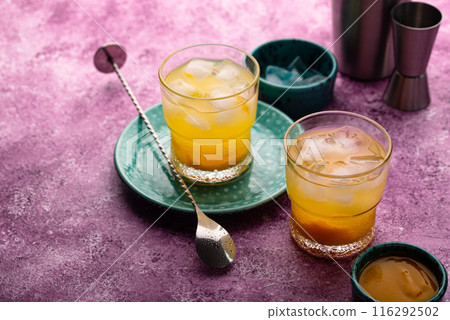 Summer cocktail with mango juice and ice 116292502