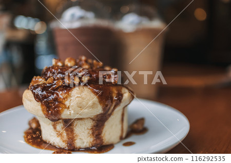 Caramel bun bakery dessert served on table in the cafe. 116292535