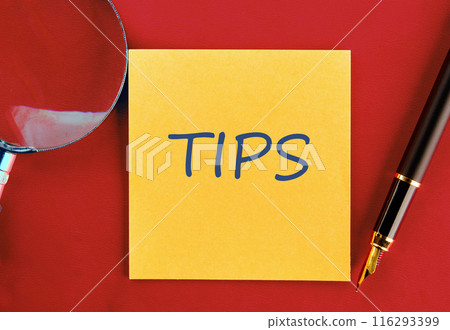 The word TIPS on a yellow sticker on a red background 116293399