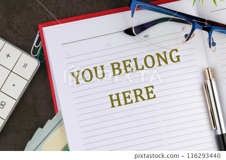 Diversity, business, inclusion and belonging concept. YOU BELONG HERE in an open business notebook Diversity, business, inclusion and belonging concept. YOU BELONG HERE in an open business notebook 116293440
