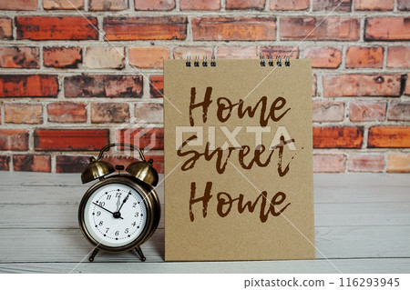 Home sweet home text message with alarm clock on wooden background, Inspriation and motivationa quote Home sweet home text message with alarm clock on wooden background, Inspriation and motivationa quote 116293945