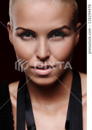 Portrait, woman and eyeliner in studio, for beauty cosmetics and transformation for confidence. Model, female person and glamour or edgy by black background for creativity, design and pride for art Portrait, woman and eyeliner in studio, for beauty cosmetics and transformation for confidence. Model, female person and glamour or edgy by black background for creativity, design and pride for art 116294476