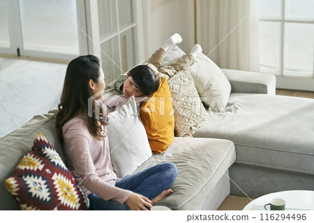 young asian mother keeping company with son 116294496
