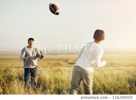 Father, son or American football in outdoor for bonding, skills practice with dad in nature. Male person, boy child and development or training in countryside, together for exercise or learning sport Father, son or American football in outdoor for bonding, skills practice with dad in nature. Male person, boy child and development or training in countryside, together for exercise or learning sport 116294505