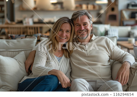 A Happy Couple Finds Their Perfect Sofa in a Furniture Store 116294654