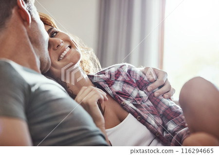 Couple, smile and relax on sofa with hug at home for support, bonding and care on weekend. Happy, peace and man with affection to woman in living room for commitment, comfort and romance in marriage Couple, smile and relax on sofa with hug at home for support, bonding and care on weekend. Happy, peace and man with affection to woman in living room for commitment, comfort and romance in marriage 116294665