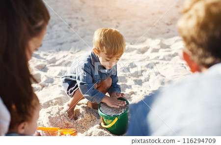 Summer, beach and boy with parents, sand and sunshine with vacation, toys and bonding together. Family, mother and father with son, seaside and adventure with holiday, getaway trip and weekend break Summer, beach and boy with parents, sand and sunshine with vacation, toys and bonding together. Family, mother and father with son, seaside and adventure with holiday, getaway trip and weekend break 116294709