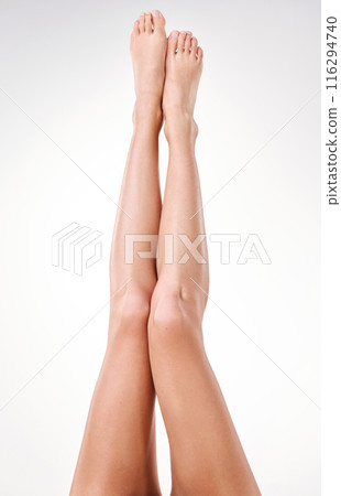 Legs, hair removal and skincare in studio with woman, feet and epilation for beauty. Spa, treatment and laser with pedicure by white background for glow, shine and luxury cosmetics or dermatology Legs, hair removal and skincare in studio with woman, feet and epilation for beauty. Spa, treatment and laser with pedicure by white background for glow, shine and luxury cosmetics or dermatology 116294740