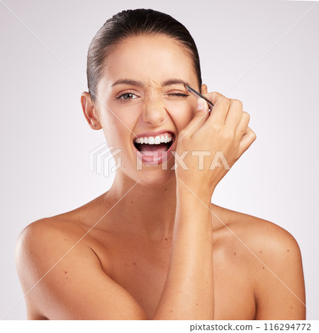 Woman, tweezers and eyebrow in studio portrait, treatment and hair removal or epilation on white background. Female person, skincare and tool for maintenance or pain, beauty and cosmetics for shape Woman, tweezers and eyebrow in studio portrait, treatment and hair removal or epilation on white background. Female person, skincare and tool for maintenance or pain, beauty and cosmetics for shape 116294772