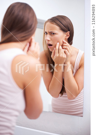 Shock, mirror and woman pop pimples in bathroom for skincare, health or wellness face routine. Upset, beauty and female person pressing zit or acne for facial dermatology treatment at apartment. Shock, mirror and woman pop pimples in bathroom for skincare, health or wellness face routine. Upset, beauty and female person pressing zit or acne for facial dermatology treatment at apartment. 116294893