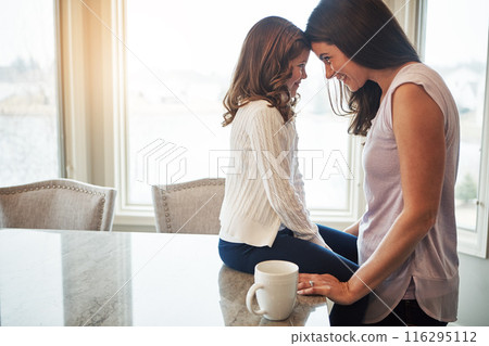 Together, mom and morning with girl, kitchen counter or woman in weekend, house and kid with love. Bonding, child and mother with daughter, joy or care in apartment, happy or relax with smile 116295112