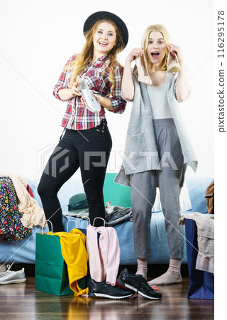 Two happy female friends after shopping Two happy female friends after shopping 116295178