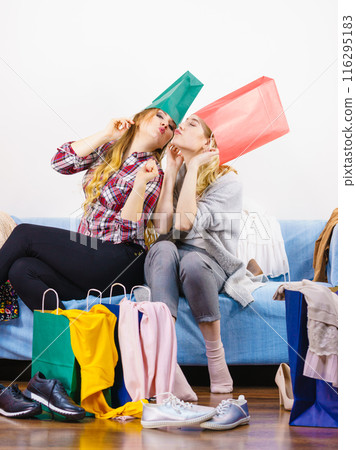 Two happy female friends after shopping Two happy female friends after shopping 116295183