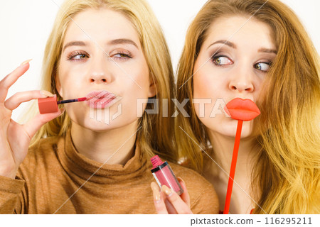 Two women and lip product Two women and lip product 116295211