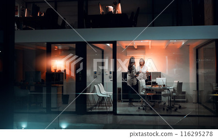 Business people, women and handshake for partnership at night in office for b2b networking, agreement and deal. Professional, employees and shaking hands in boardroom with tablet for project feedback 116295278