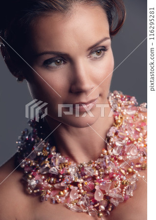 Woman, thinking and elegant for necklace in studio, fashion and shine or grace style. Female person, contemplating and aesthetic for classy or jewellery, accessory and confidence on gray background 116295281