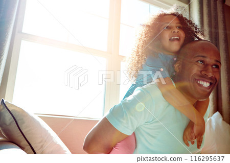 Man, dad and girl with smile in piggyback on sofa at home for fun, bonding and care with trust. Parent, daughter and kid with happiness for playing on couch to support, relax and child development Man, dad and girl with smile in piggyback on sofa at home for fun, bonding and care with trust. Parent, daughter and kid with happiness for playing on couch to support, relax and child development 116295637