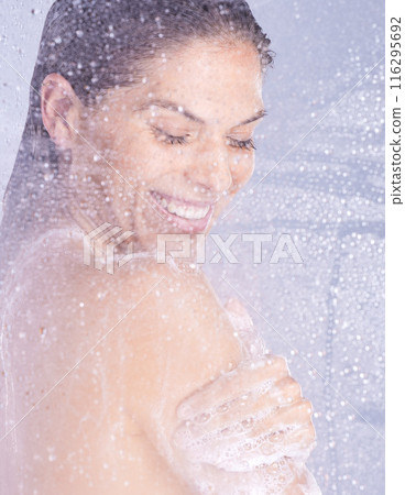 Wash, water drops and woman with shower in studio for hygiene, treatment or morning routine on white background. Steam, glass and female model with body care for grooming, satisfaction or wellness Wash, water drops and woman with shower in studio for hygiene, treatment or morning routine on white background. Steam, glass and female model with body care for grooming, satisfaction or wellness 116295692