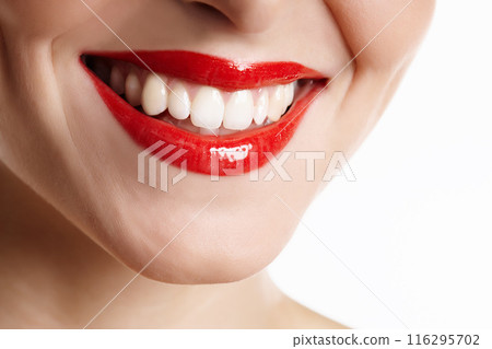 Woman, mouth and happy with red lipstick in studio with makeup, dental and cosmetics treatment with closeup. Person, teeth and dermatology with lip product, cosmetology beauty on white background 116295702