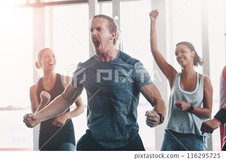Fitness, man and shout to celebrate success in exercise class, workout and training goals. Sports, people and happiness for power challenge, winner or performance achievement at health club or gym 116295725