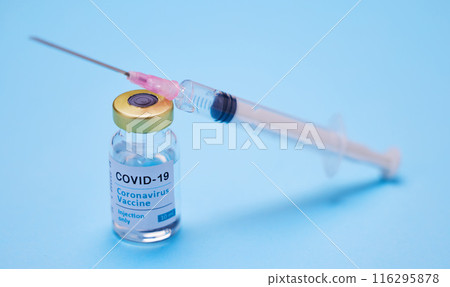 Needle, safety and vaccine or vial in studio for wellness, healthcare and medicine for disease. Pharmaceutical, drugs and syringe for innovation by blue background for virus protection or prevention 116295878