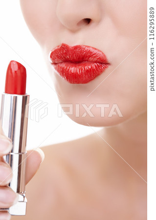 Woman, pout and mouth for red lipstick in studio, makeup and cosmetics for care on white background. Female person, skincare and silver tube, beauty and application of gloss or skin treatment 116295889