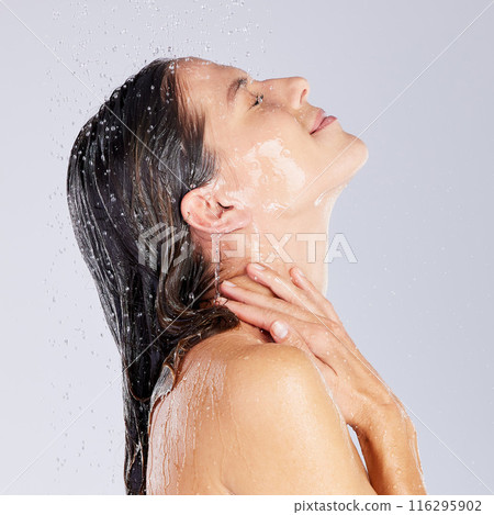 Woman, water drops and washing or facial in studio, clean and shower for cosmetic or hygiene. Female person, skincare and grooming on white background, beauty and refreshing liquid for routine pamper 116295902