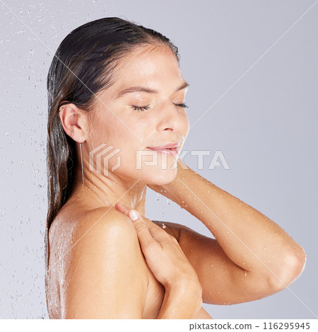 Woman, shower and washing hair in studio, cleaning and running water for cosmetic or hygiene. Female person, haircare and grooming on white background, beauty and refreshing liquid for routine pamper 116295945