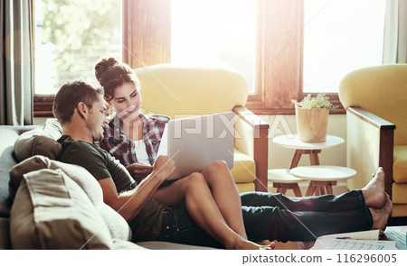 Happy couple, laptop and relax on sofa for budget, planning and savings account for personal debt. Man, woman and together on couch with computer for expenses, tax and loan payment in living room 116296005