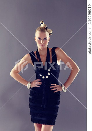 Studio portrait, woman and confident for fashion show or runway with unique style inspiration and wellness. Model, elegant lady and vintage clothes for designer brand and luxury by grey background 116296019