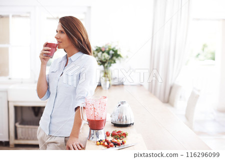 Woman, drink and glass in kitchen for smoothie or milkshake, handmade and fresh recipe for breakfast detox diet. Girl, strawberry and ideas for meal alternative, vitamin boost and natural nutrition. 116296099