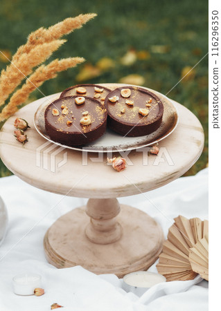 Whimsical Cake Creation With Unique Fan Decor 116296350