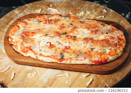 Sizzling Pizza on Rustic Wood 116296352