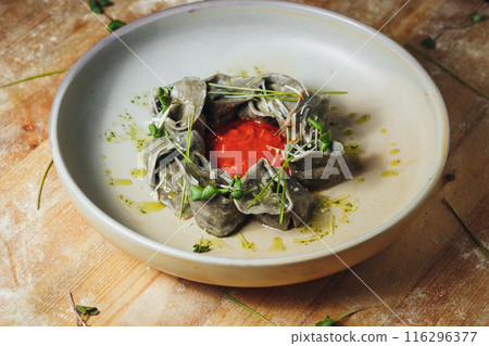 A Symphony of Dumplings on a Rustic Table 116296377