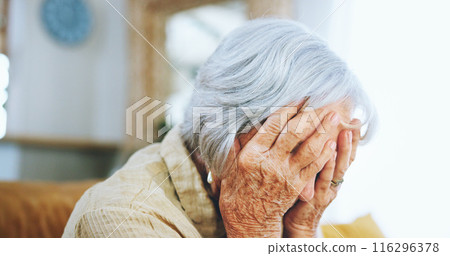 Senior woman, mistake and depression with headache, stress or anixety on living room sofa at home. Closeup of elderly, sad female person or hands on face in fear for alzheimers, dementia or fatigue 116296378