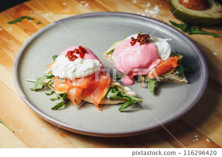 Elegant Eggs Benedict: Salmon and Avocado Delight 116296420