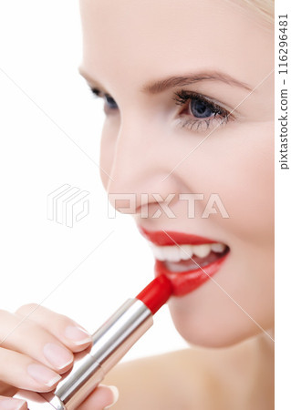 Woman, beauty and color for lipstick in studio, makeup and cosmetics for care on white background. Female person, red and skincare or silver tube, glow and application of gloss or skin treatment 116296481