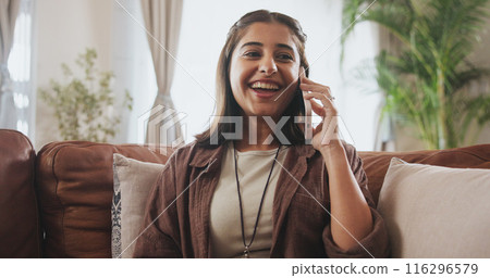 Happy, woman and phone call on sofa for conversation, communication or internet connection in home. Female person, smile or excited with mobile tech on couch for chat talking and social media 116296579