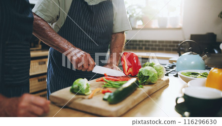 Hands, people and cutting board in kitchen with help, support and teaching at home for healthy food. Chef with knife for cooking lunch and nutrition with bell pepper, cucumber and green vegetables Hands, people and cutting board in kitchen with help, support and teaching at home for healthy food. Chef with knife for cooking lunch and nutrition with bell pepper, cucumber and green vegetables 116296630