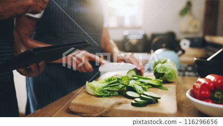 Hands, tablet and salad recipe in kitchen with help, support and teaching at home for healthy food. People cooking lunch on digital tech for nutrition tips with lettuce, cucumber and green vegetables 116296656