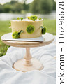 Enchanted Cake on Grassy Stand 116296678