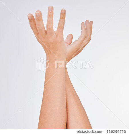 Woman, hands and manicure or pamper in studio, touch and clean polish for cosmetics on white background. Female person, nail care and grooming treatment or hydration, beauty and dermatology wellness 116296750